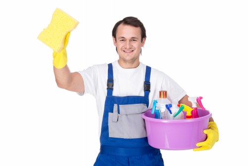 Close-up of a technician performing upholstery cleaning on a chair
